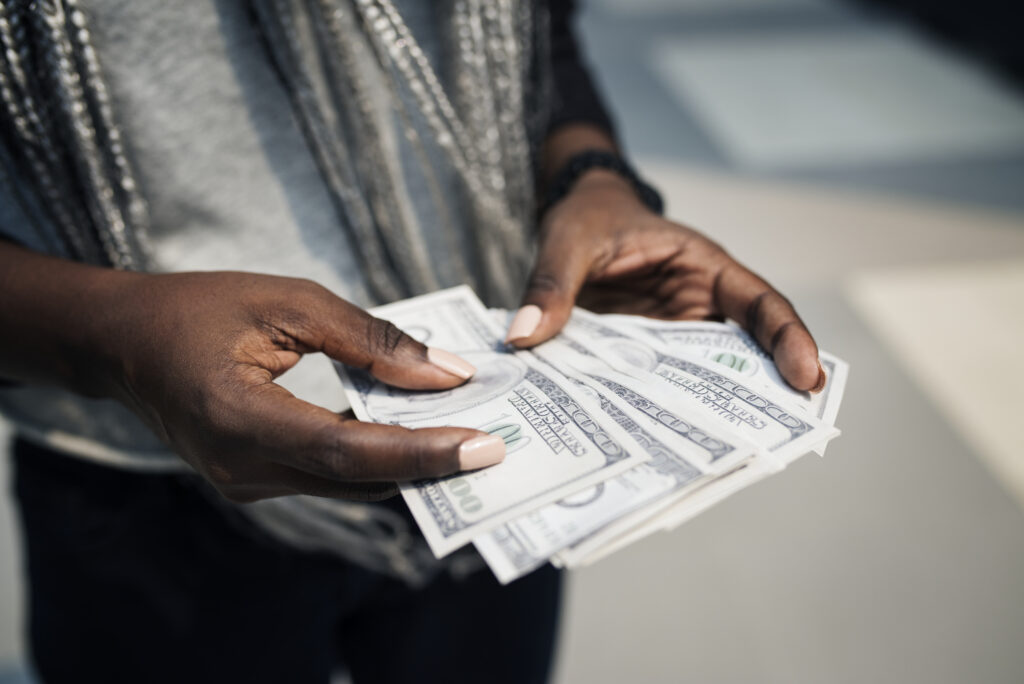 hands holding money
